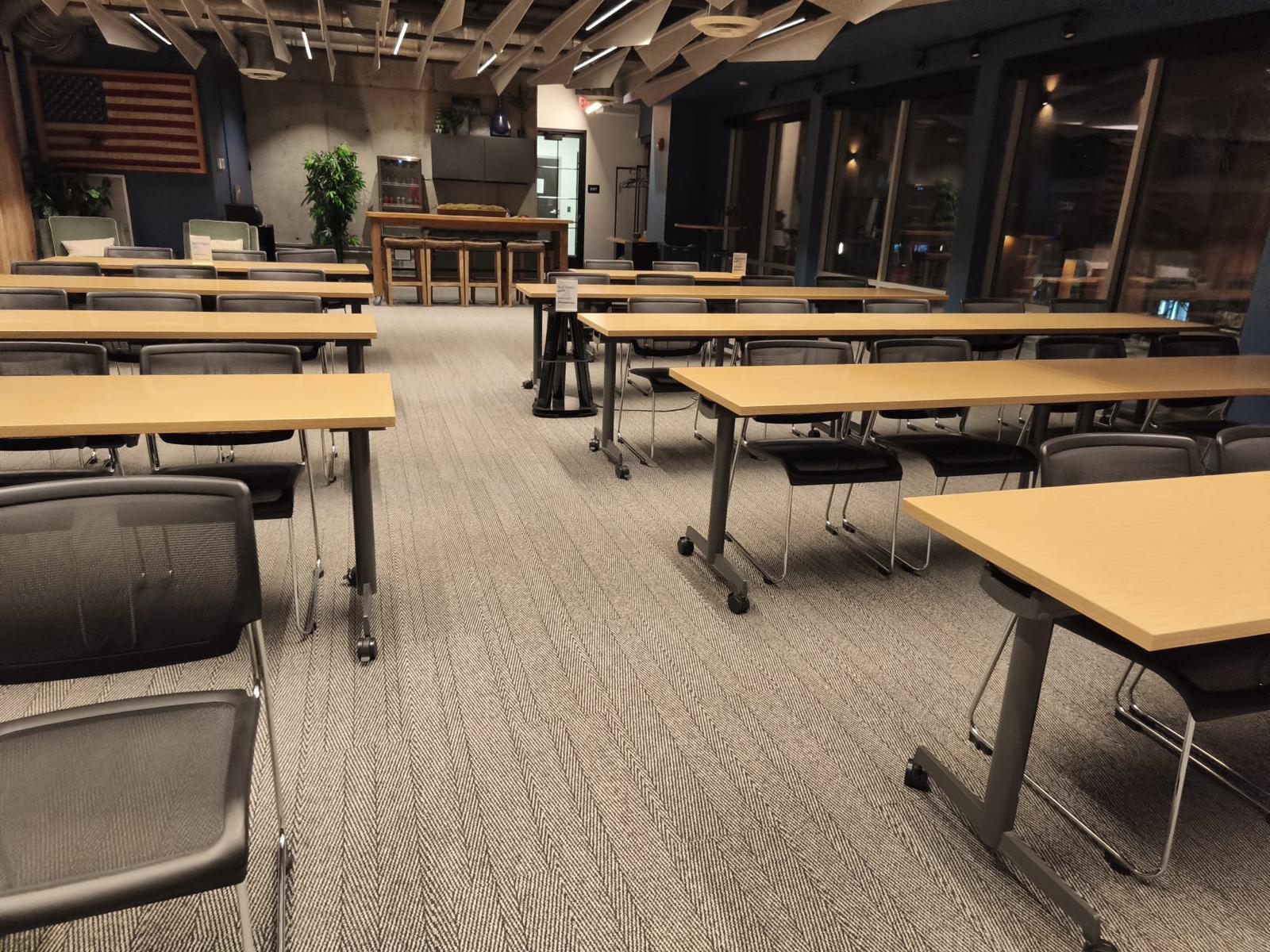 Meeting room with rows of tables and carpet, photographed at an MB General cleaning job